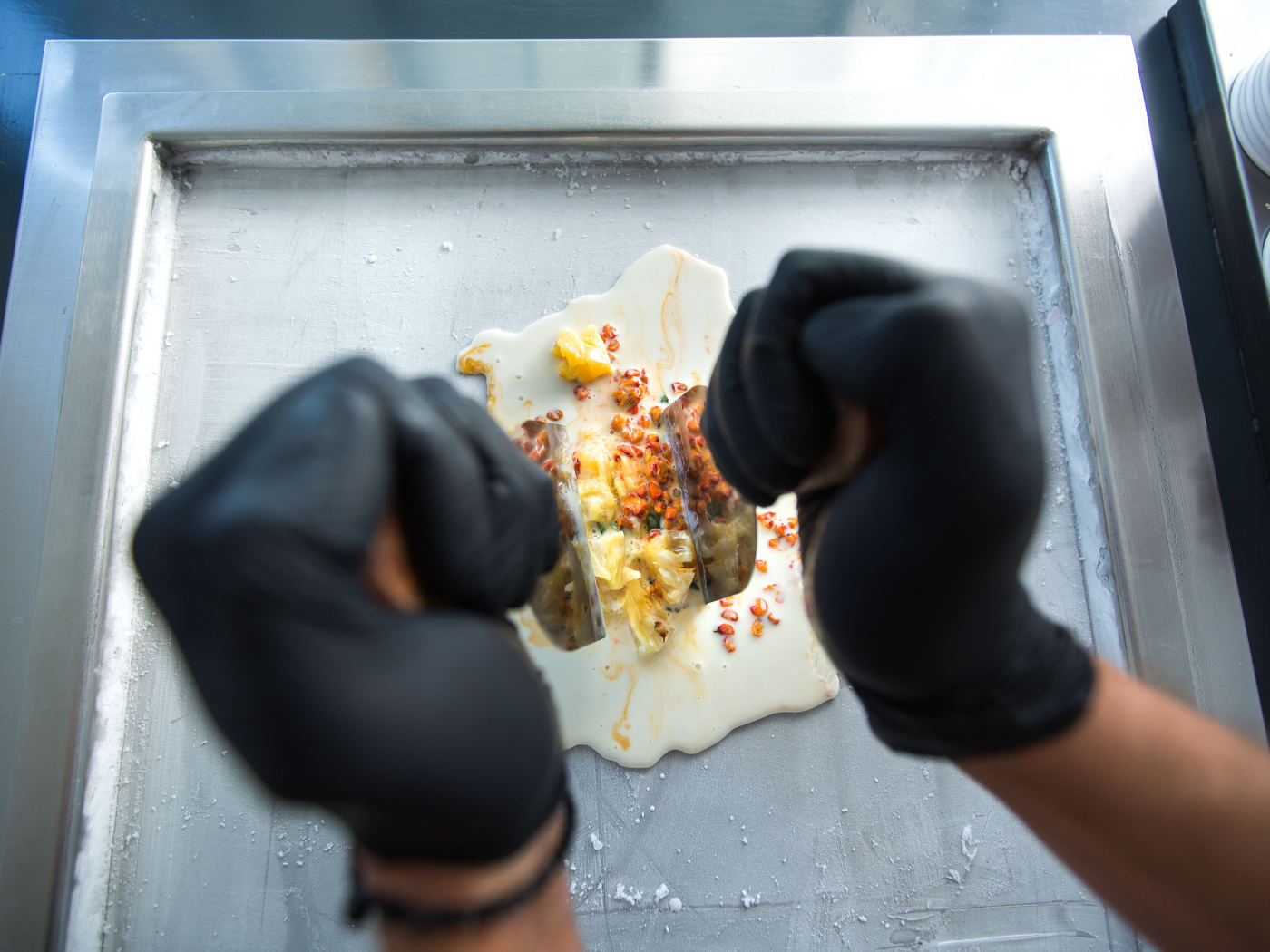 Ice cream mixture being spread on a cold plate